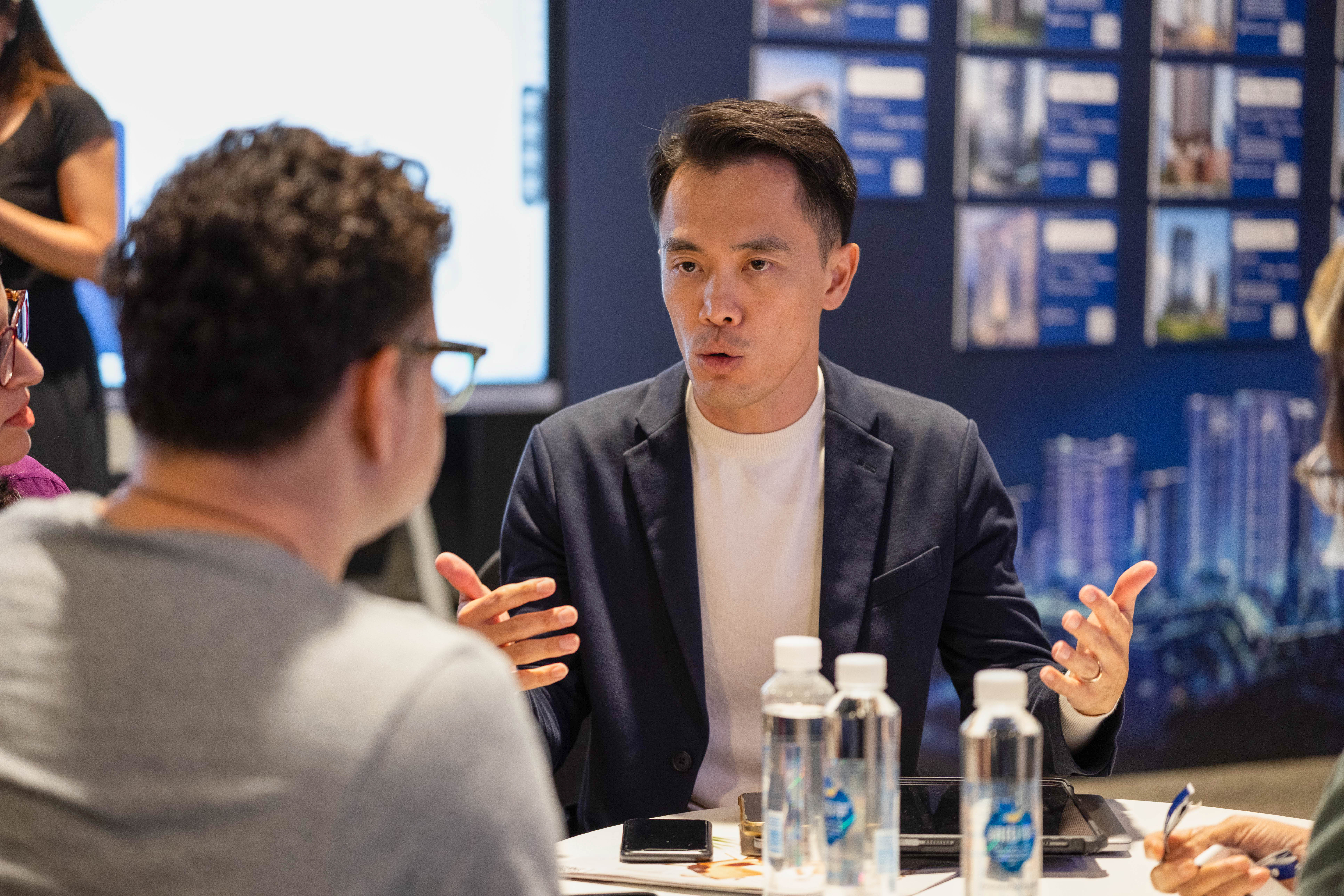 George consulting with client at New Launch Convention