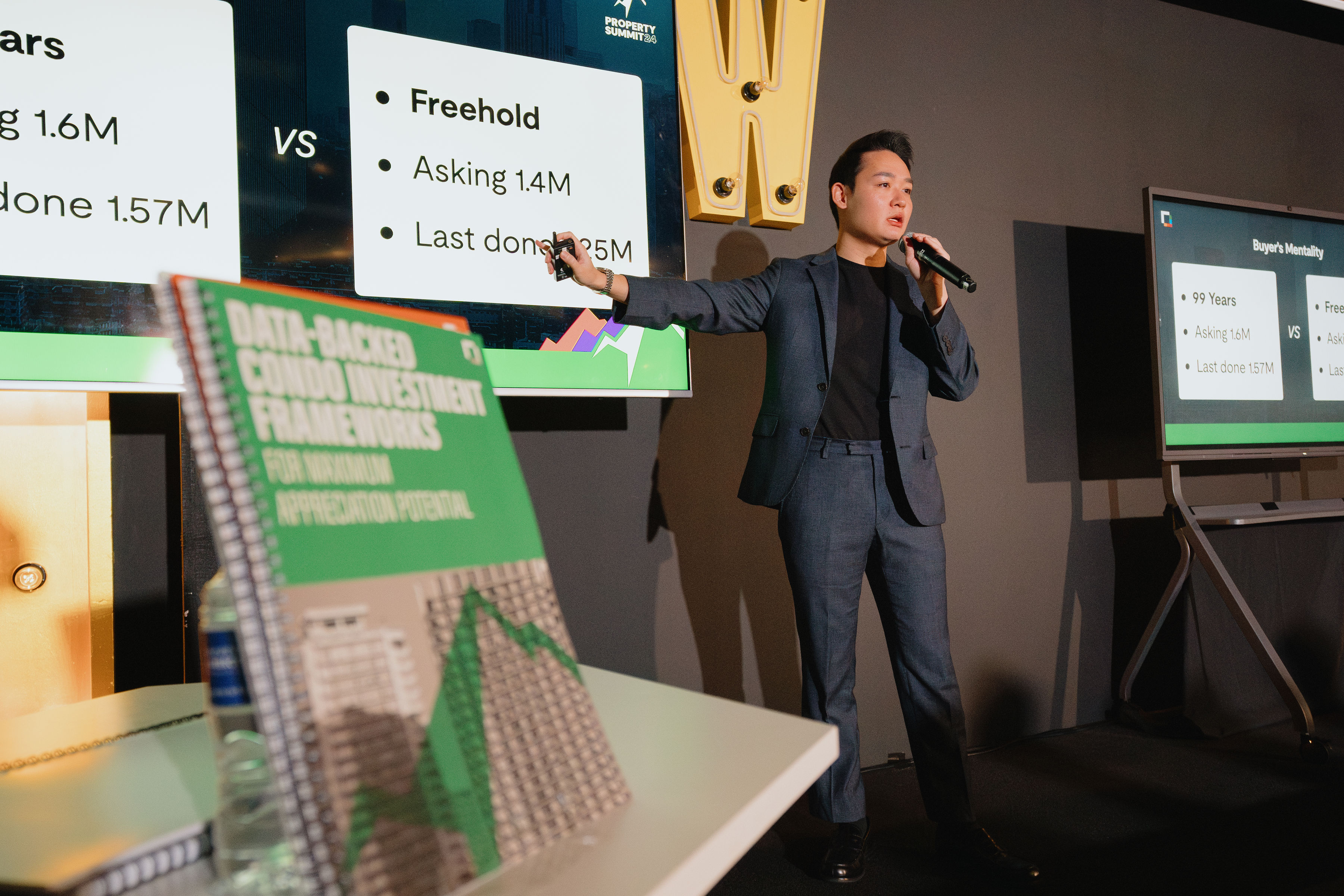 Jun Wei presenting condo investment frameworks at Property Summit 2024
